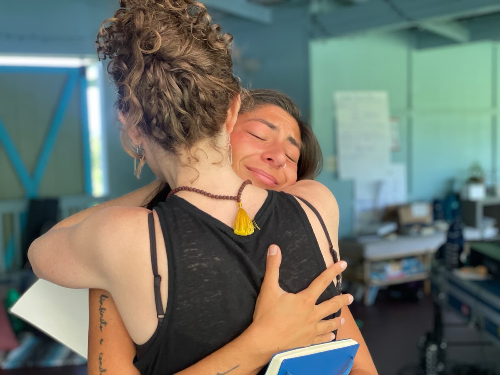 Two people embracing with their eyes closed