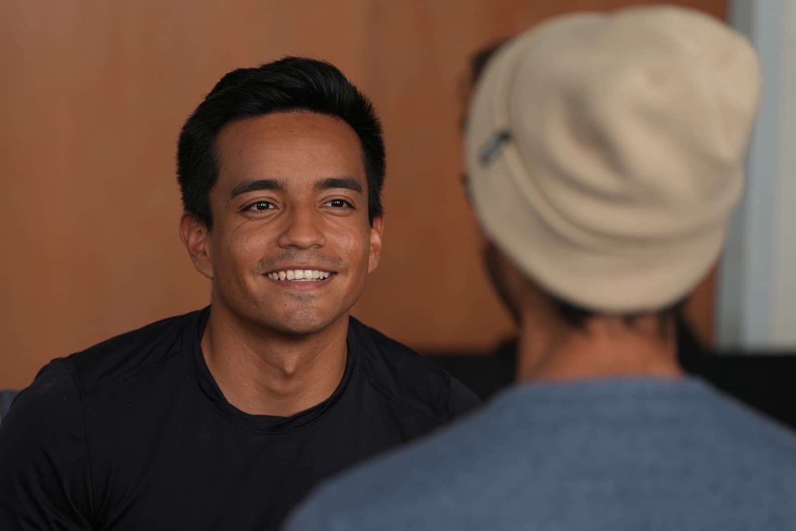A camper smiling in conversation at a Sleepawake workshop